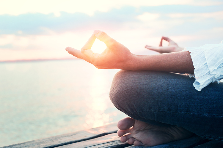 Peaceful woman finding body and mind balance